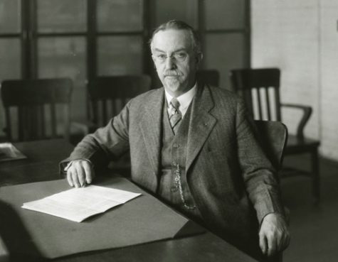 Dean of Agriculture, Alfred Vivian sitting at his desk; 1921