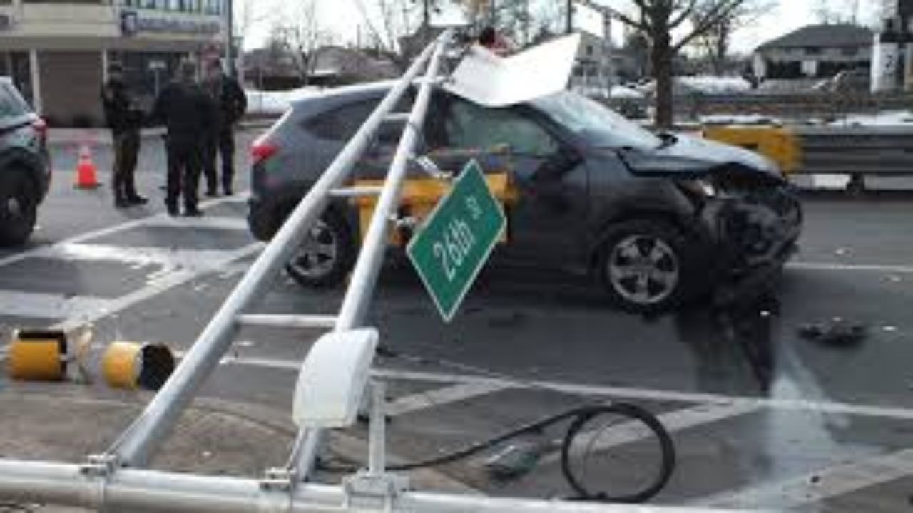 Two Women Hospitalized After Crash Topples Traffic Light at Broadway and 26th Street